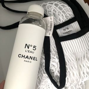 Chanel No.5 water bottle and fishnet bag